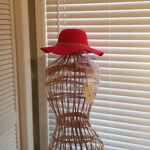 Red. Floppy hat with gold chain.